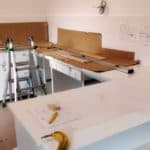 White Kitchen With Construction Materials And Tools, In Progress.