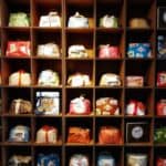 Colorful Gift Bags Arranged In Wooden Cubicles At Architects Srl.