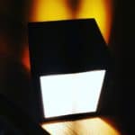 Contemporary Led Light Fixture Emitting Bright White Light In A Dark Room.