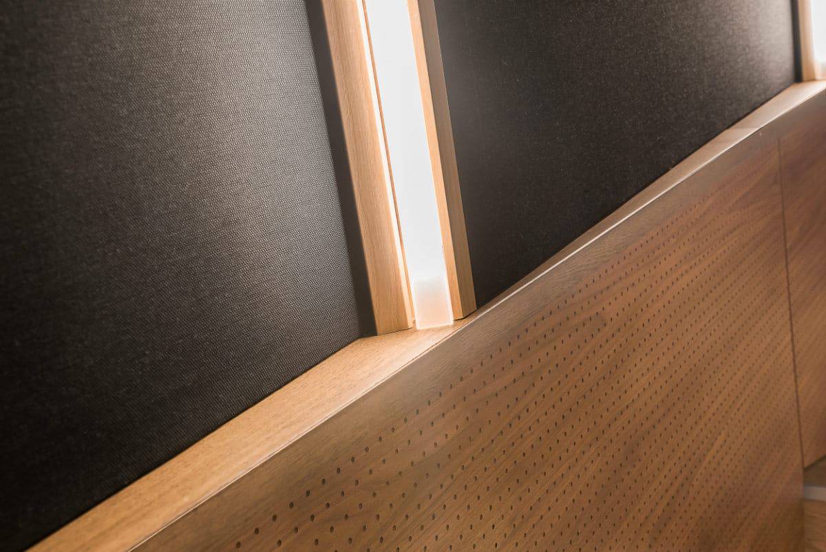 Interior Wall Paneling With Wood And Black Acoustic Panels At Multiplex Cinema Electric.