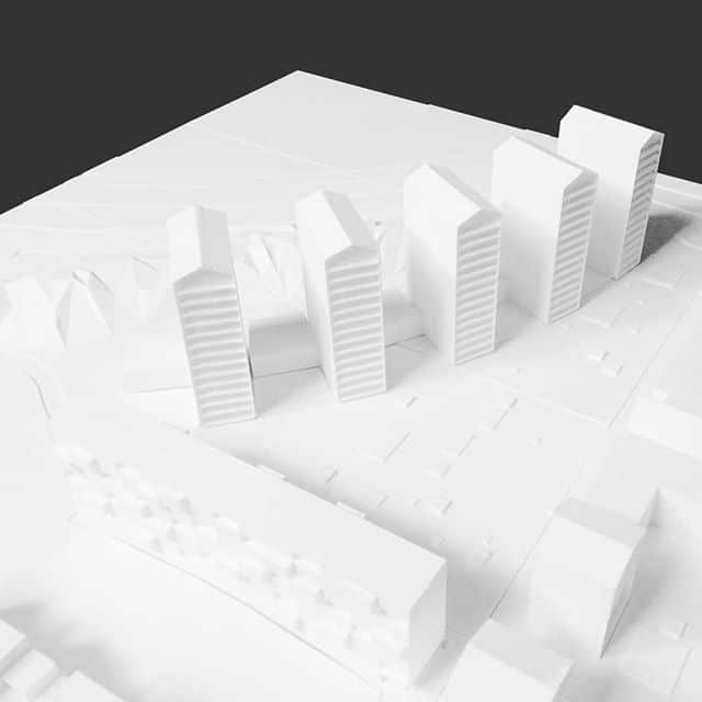 Architectural model of new development White Architectural Scale Model Of A New Building Development Project.