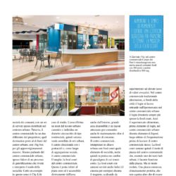 Modern Retail Space Interior With Blue Accents And Seating Areas.