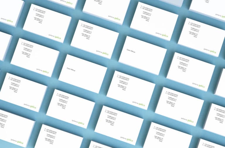 Collection Of White Business Cards With Green And Black Text On A Blue Background.