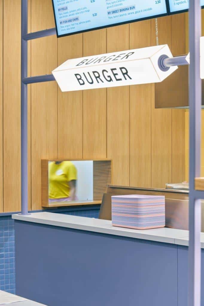 Burger sign at a fast-food counter in Milan.