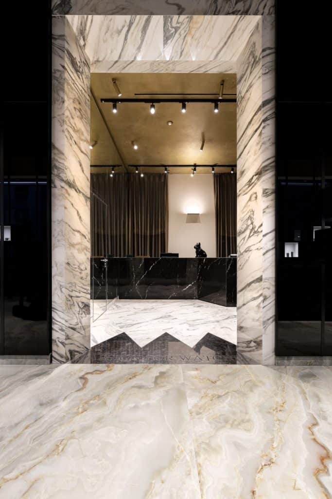 Elegant Marble Entrance With Modern Lighting At Ruzza Orologi &Amp; Bags.
