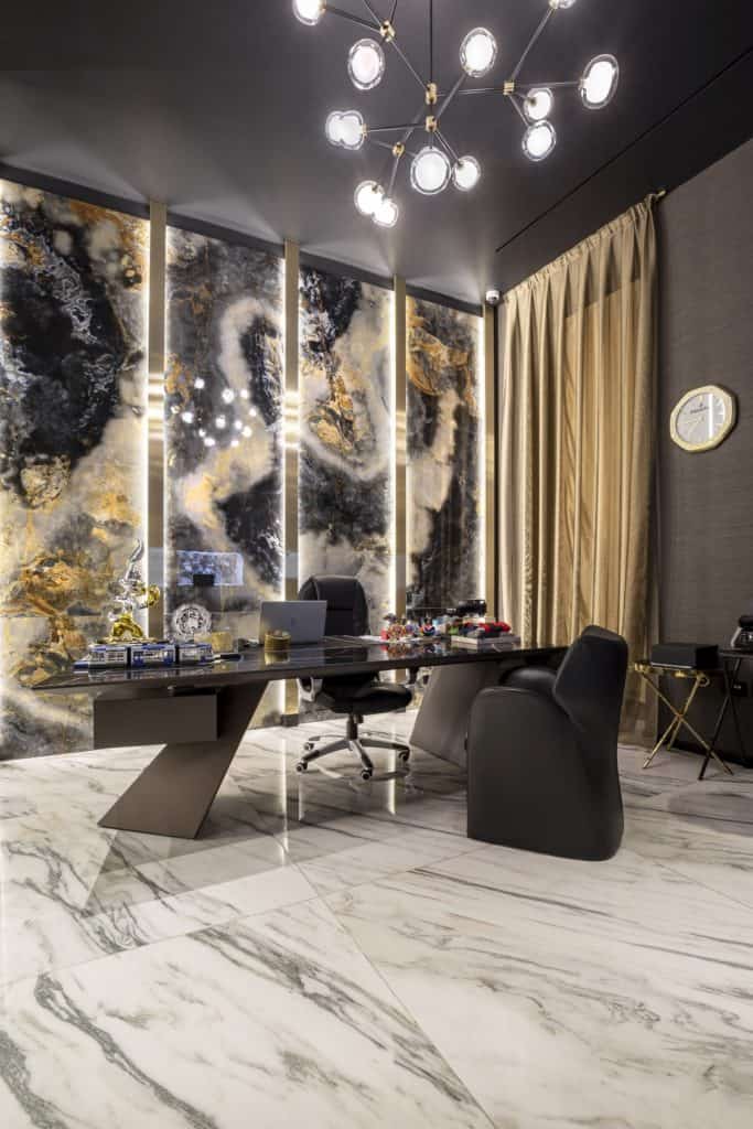 Modern Office With Marble Walls And Stylish Lighting Fixtures.