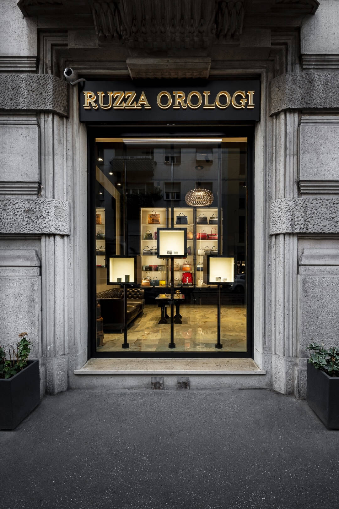 Ruzza Orologi storefront with elegant signage and display window.
