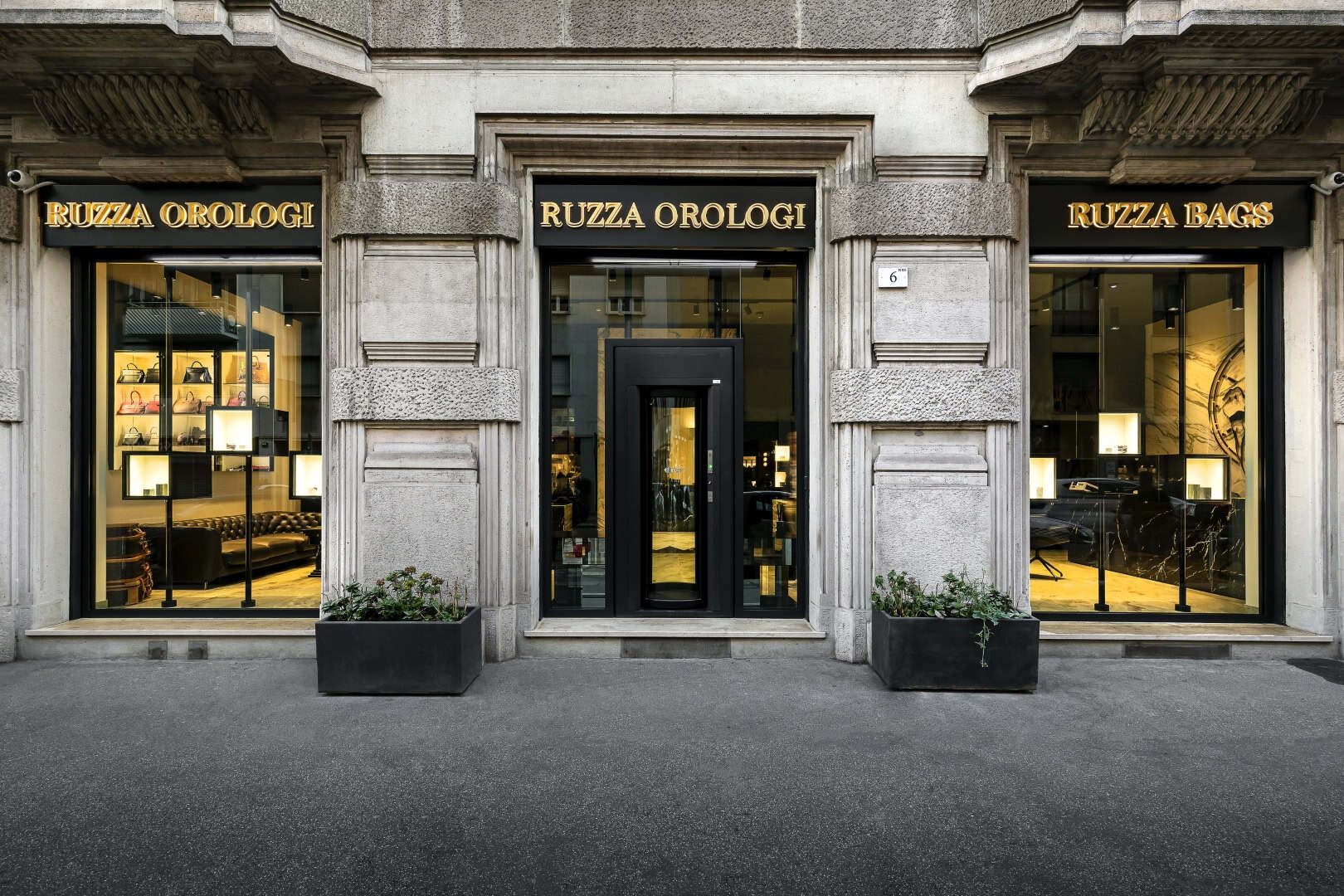 Exterior view of Ruzza Orologi & Bags storefront with classic architecture.