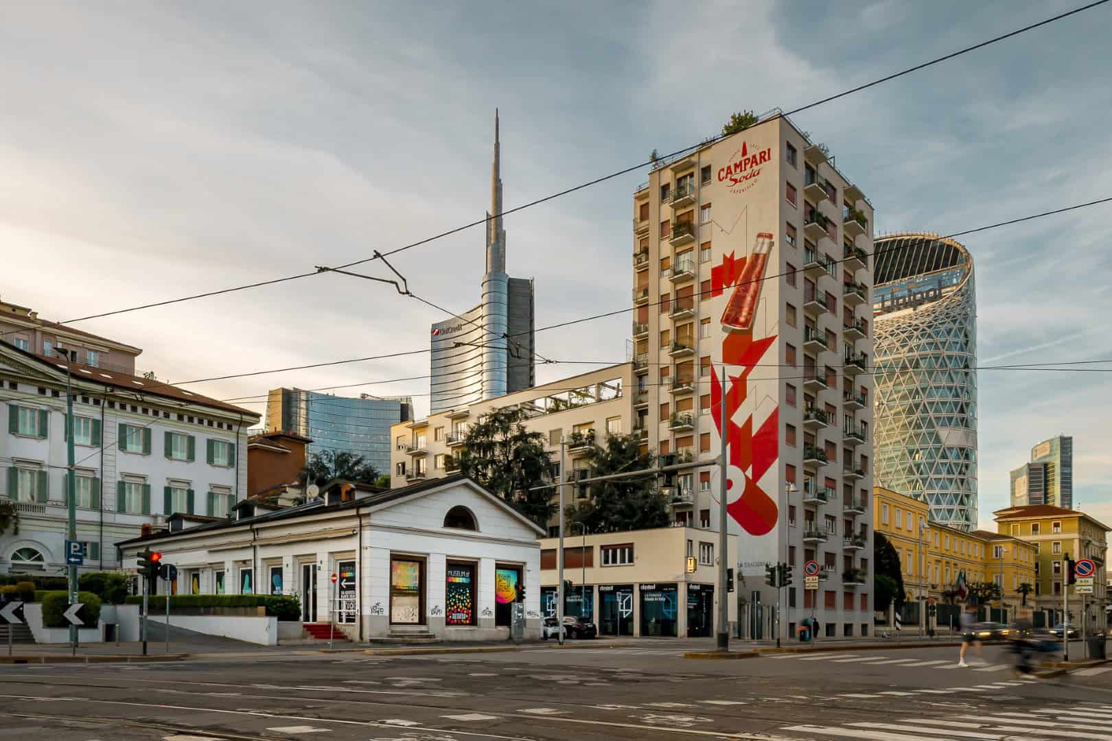 Urban cityscape with modern skyscrapers and historic buildings in Milan, Italy.
