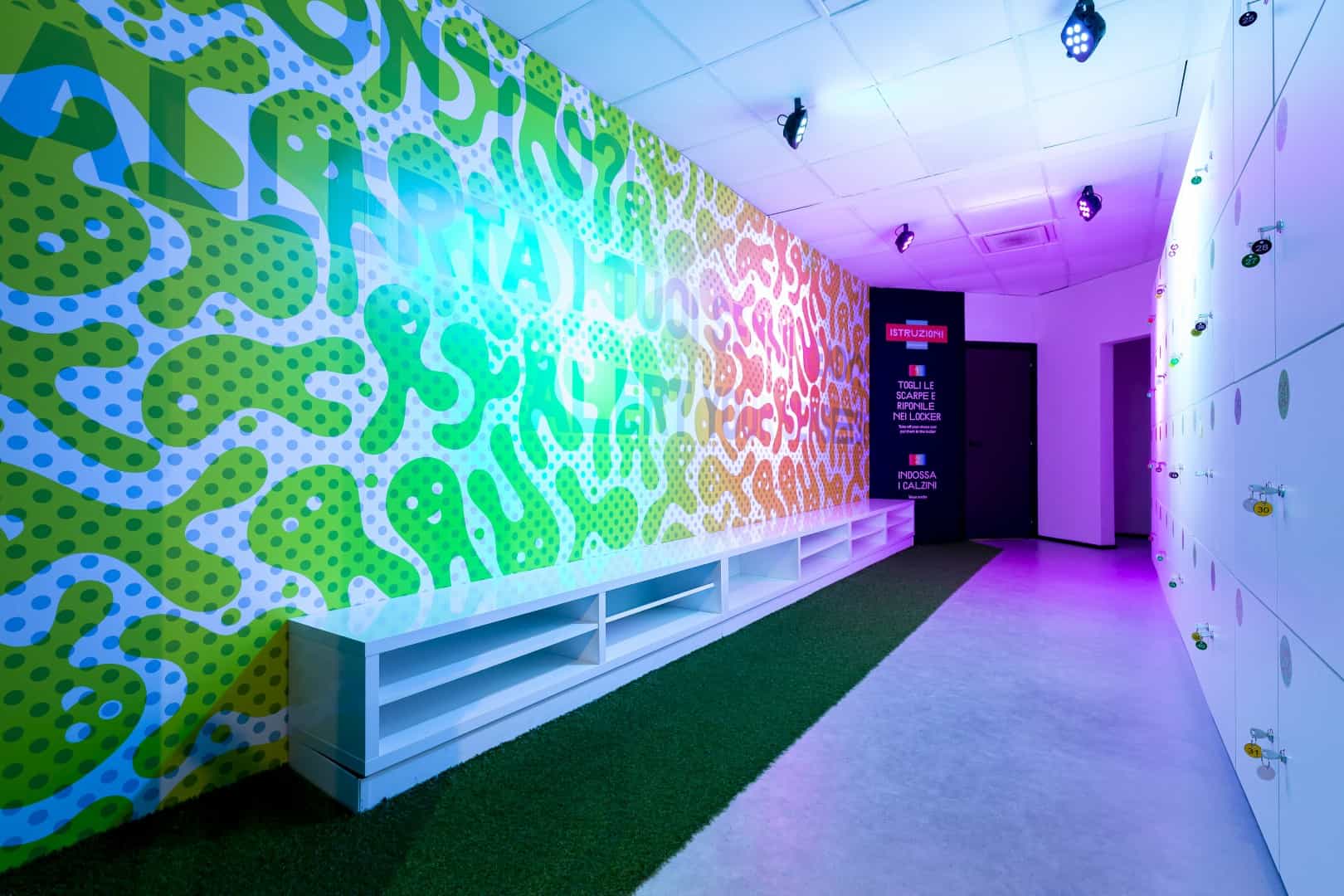 Colorful, abstract wall art in a modern sensory room at the Museum of Senses.