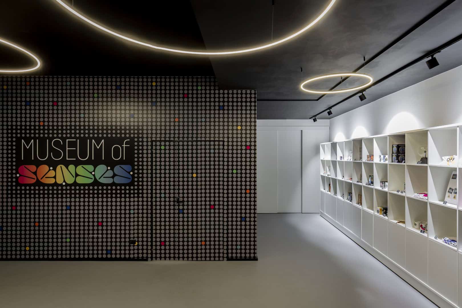 Interior view of Museum of Senses with modern lighting and display shelves.