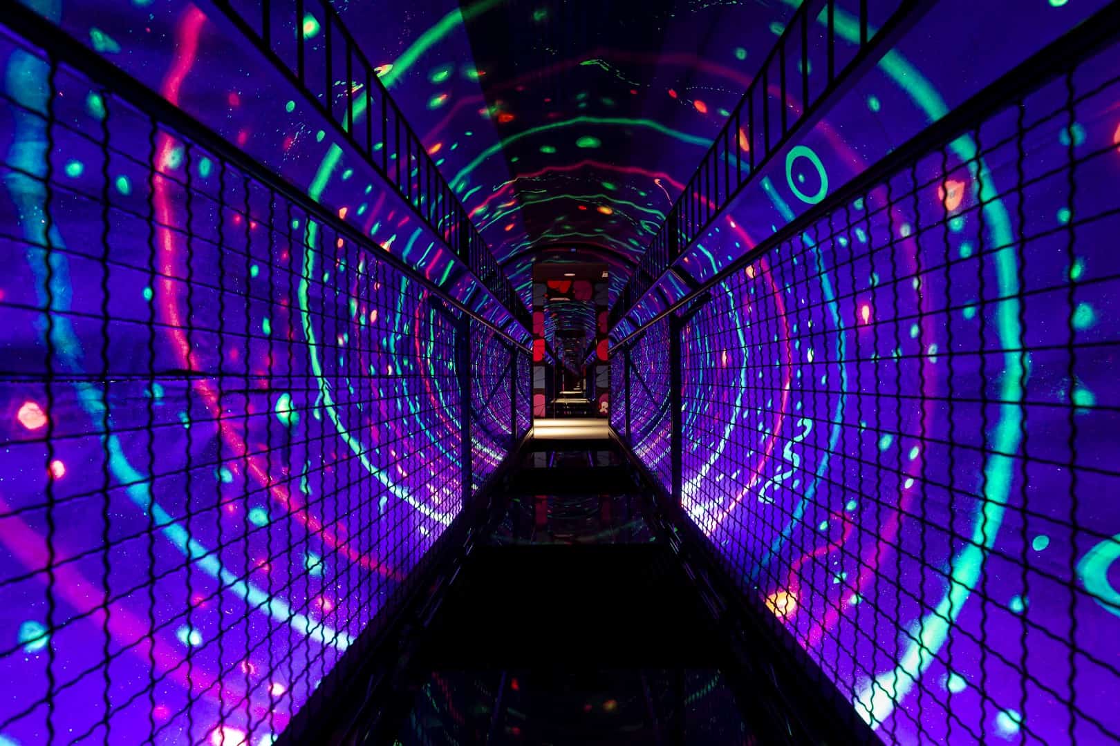 Colorful LED tunnel with vibrant light patterns at the Museum of Senses.