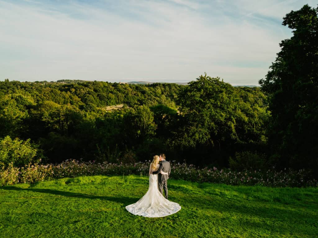Wedding couple in a scenic countryside setting at Hyde Bank Farm.