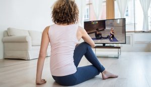 &nbsp;>thisisjustarandomplaceholder<Fit woman exercising at home watching a DVD | Iberian Press®&nbsp;