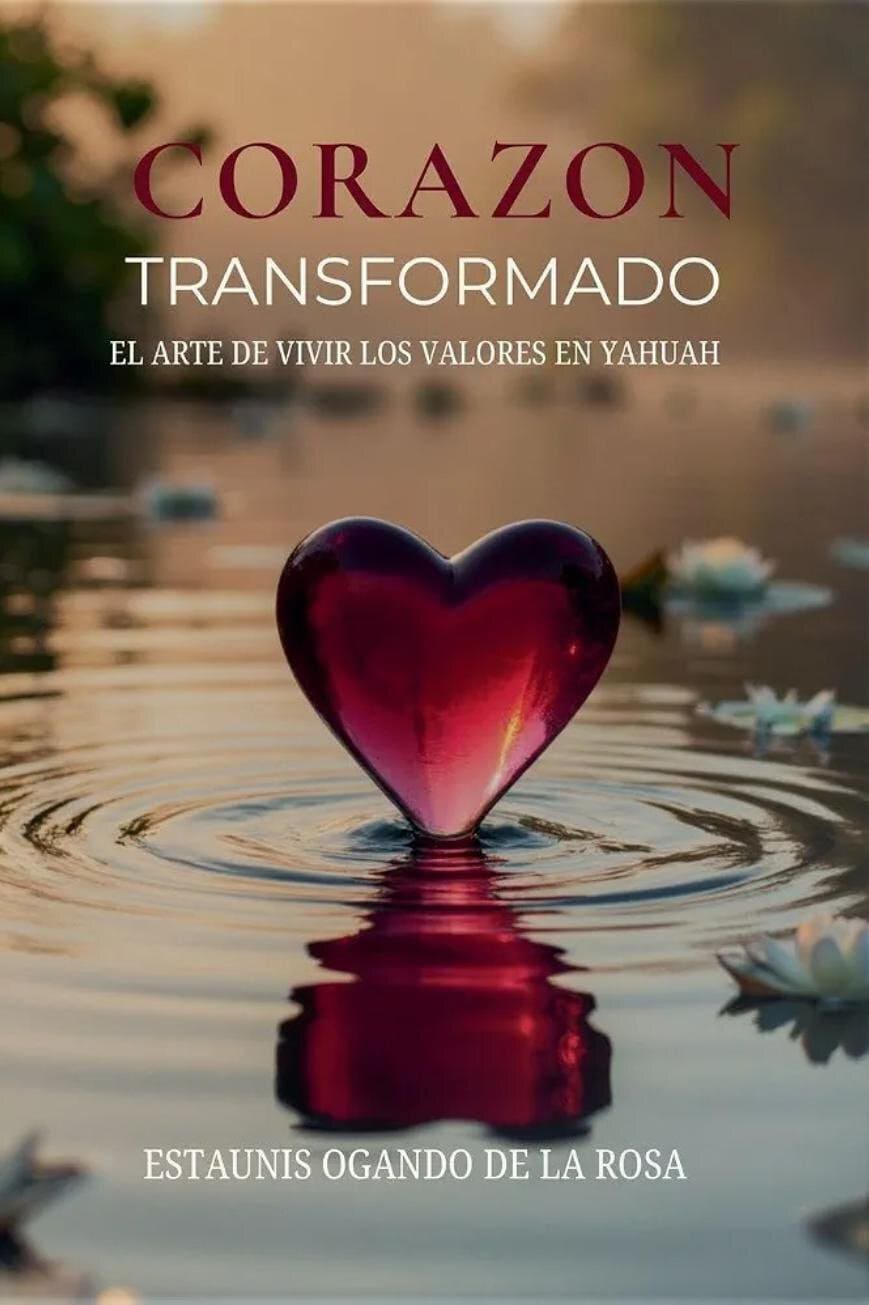 Book cover showing a glossy red heart floating in water with ripples at sunset; title 'CORAZON TRANSFORMADO' and author name below.