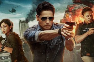 High-Octane Action Movie Scene Featuring Police Officers And Armed Characters In Front Of A Cityscape With Explosions And Helicopters, Emphasizing Inside Box Office Hits And Blockbuster Film Analysis.