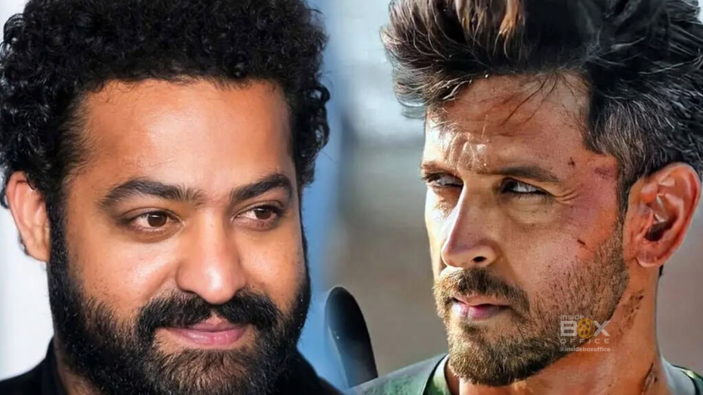 Close-Up Of Two Male Actors Engaged In Intense Dialogue From A Popular Indian Film, Showcasing Strong Performances And Expressive Facial Features In A Dramatic Scene.