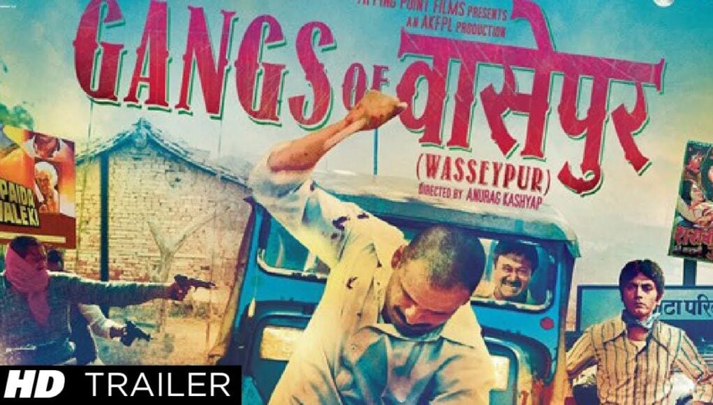 Video Thumbnail: Gangs of Wasseypur Theatrical Trailer | Manoj Bajpai Gangs of sighty (Wasseypur) movie poster with action scene from the film featuring a man attacking someone from an auto rickshaw, vibrant colors and bold text promoting the film's trailer and release.
