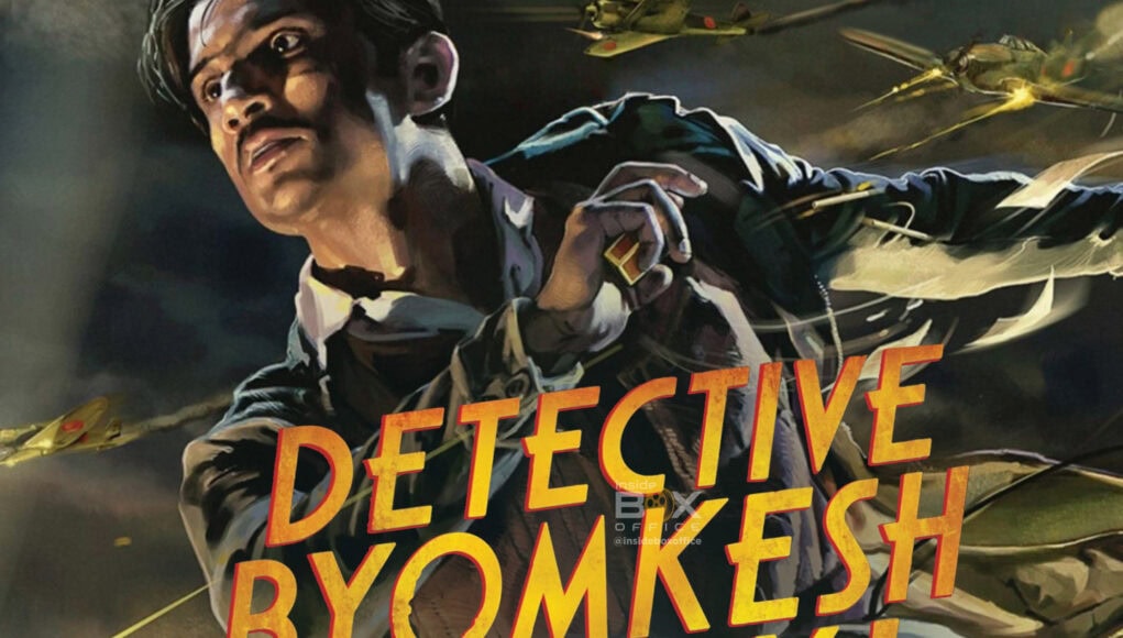 High-energy action scene from the movie "Detective Byomkesh Bakshy!" featuring a dynamic character with flying aircraft in the background, emphasizing thriller and detective film themes.