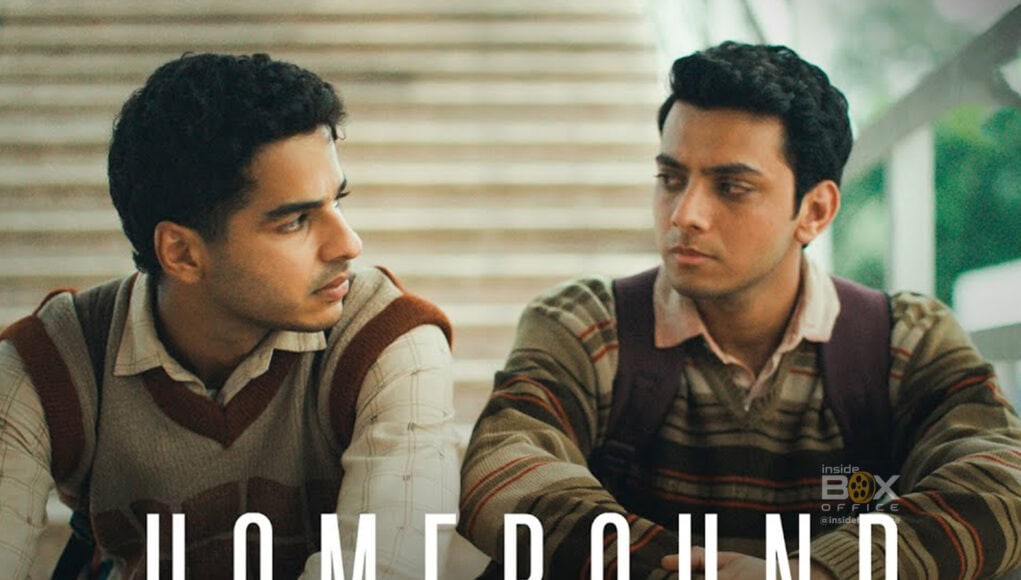 Deep conversation between two young men sitting indoors, movie-themed atmosphere, showcasing friendship and emotional connection for Inside Box Office.