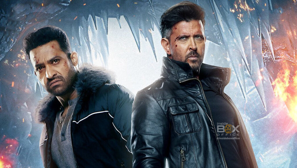 Fictional image from the movie WARS 2 featuring two serious male characters in a sci-fi action setting with icy cave environment.