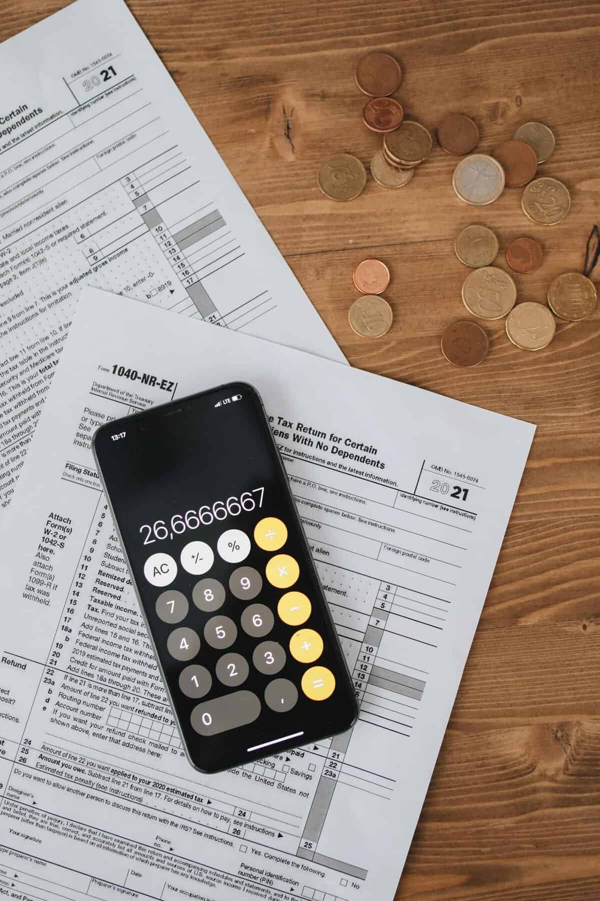 Tax forms with calculator and coins for 1031 exchange planning