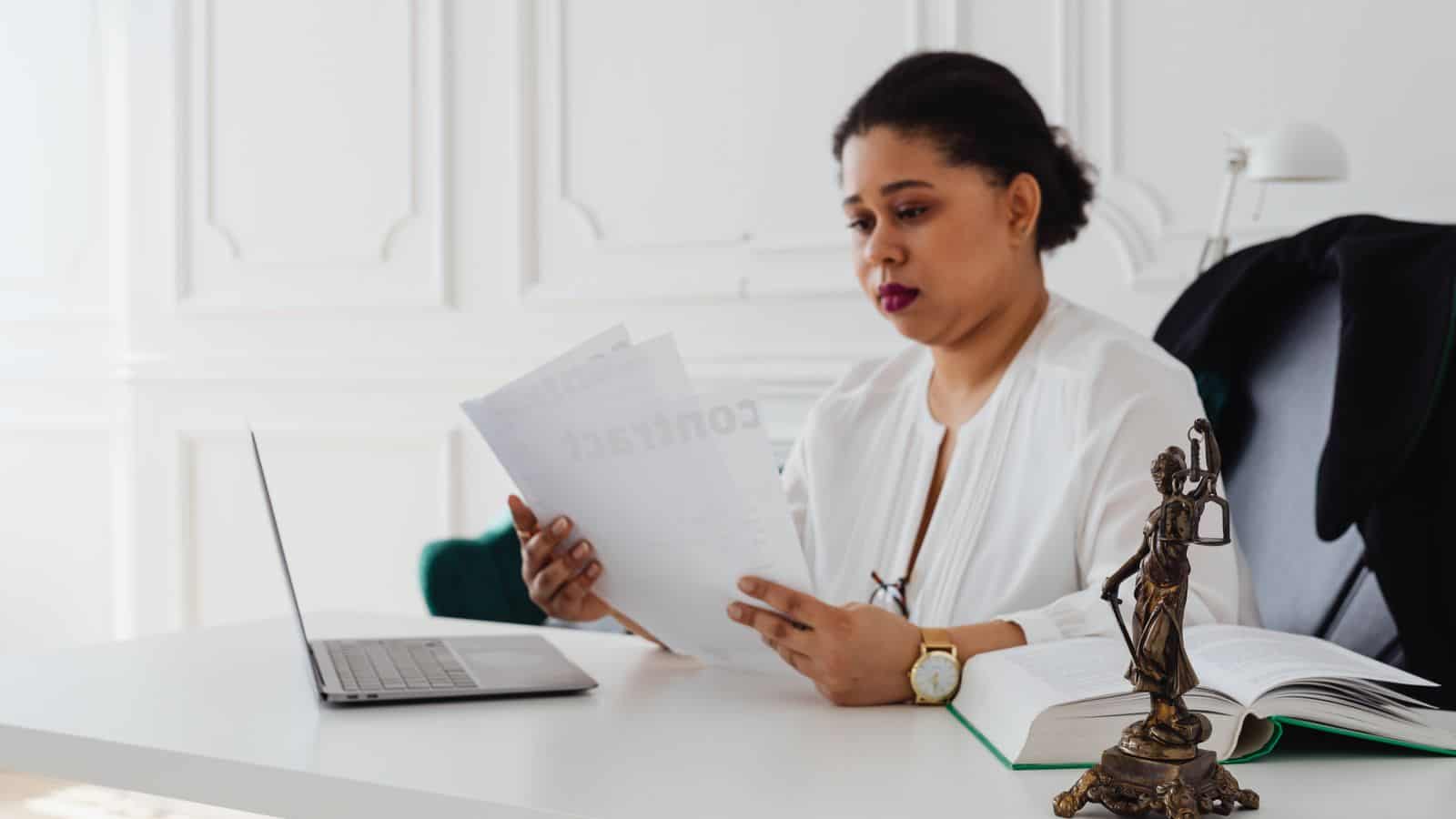 Las Vegas landlord reviewing rental application and tenant screening documents at a desk