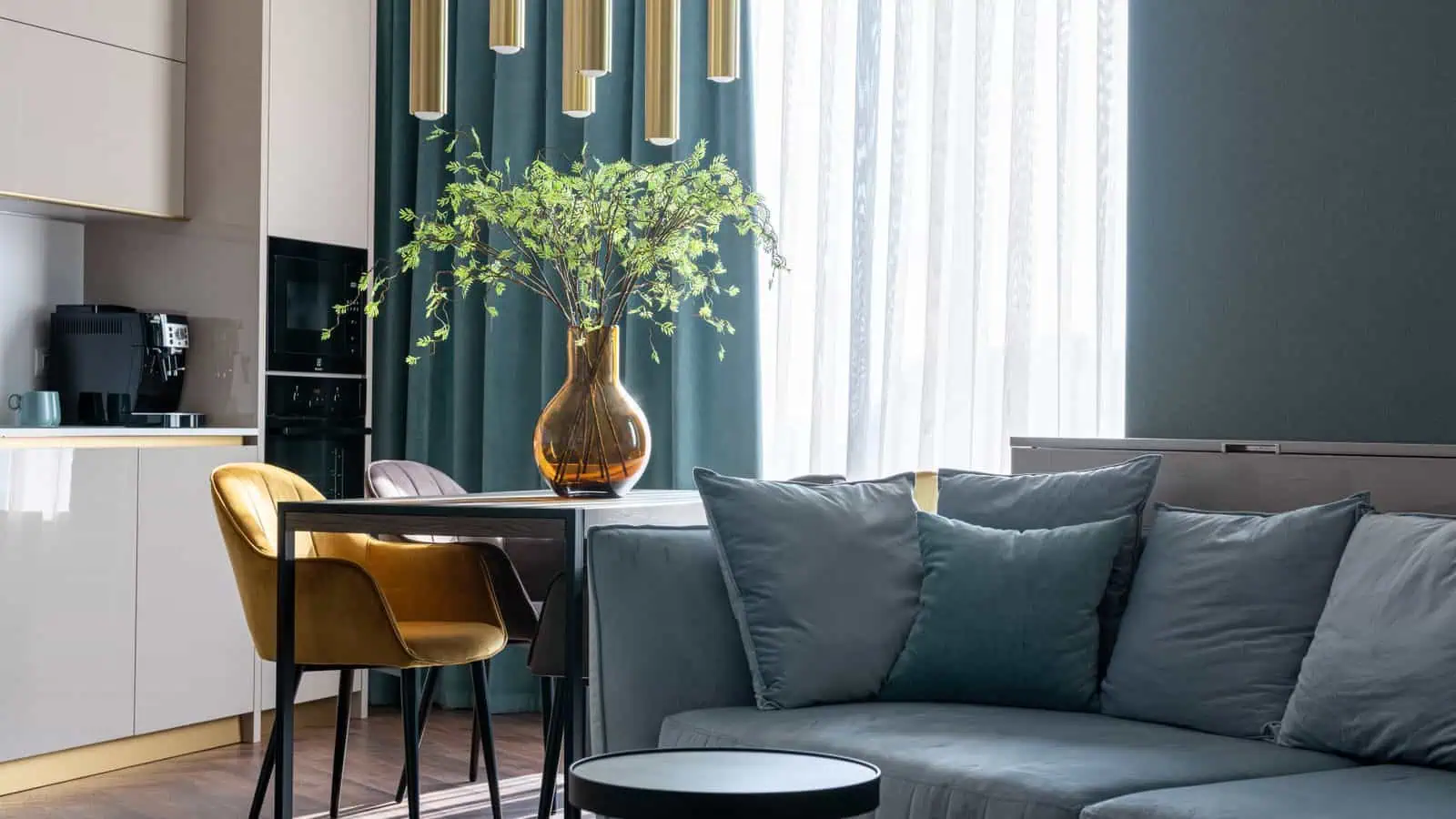 Furnished Las Vegas studio apartment with a sofa, cushions and a wooden coffee table