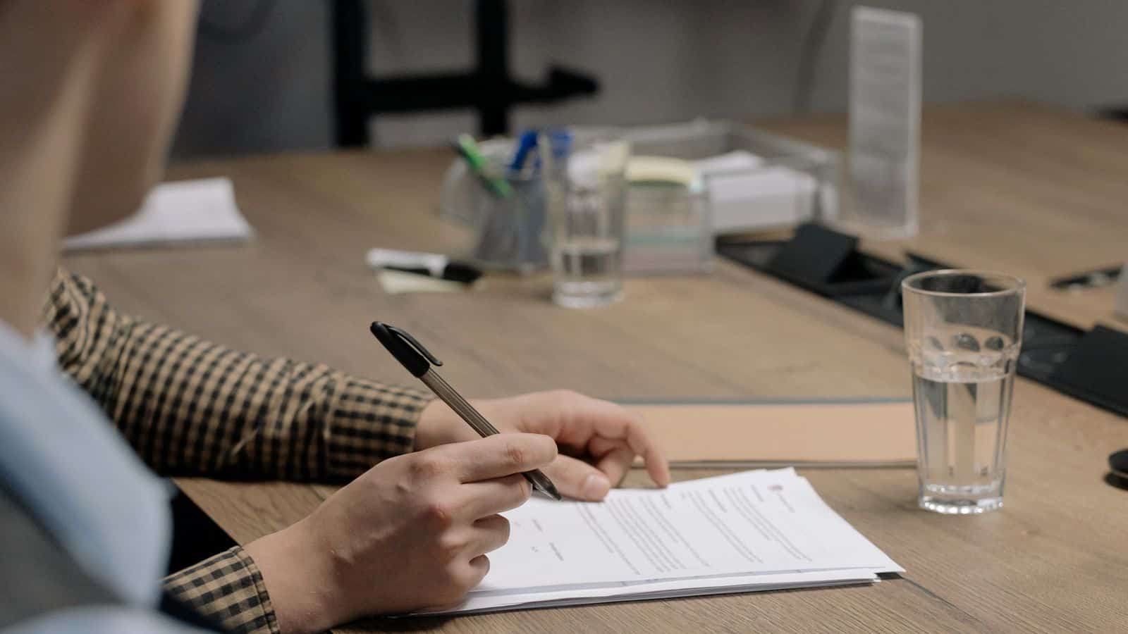 Property manager reviewing a Nevada eviction notice document at a desk