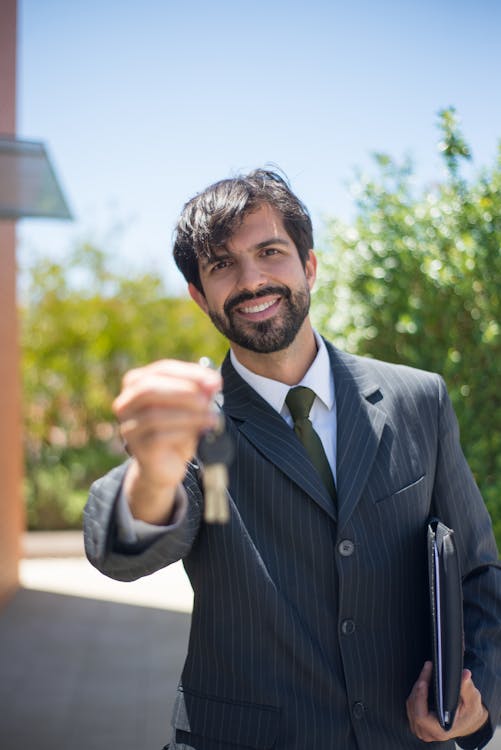 Property manager handing over house keys to a new Las Vegas rental owner