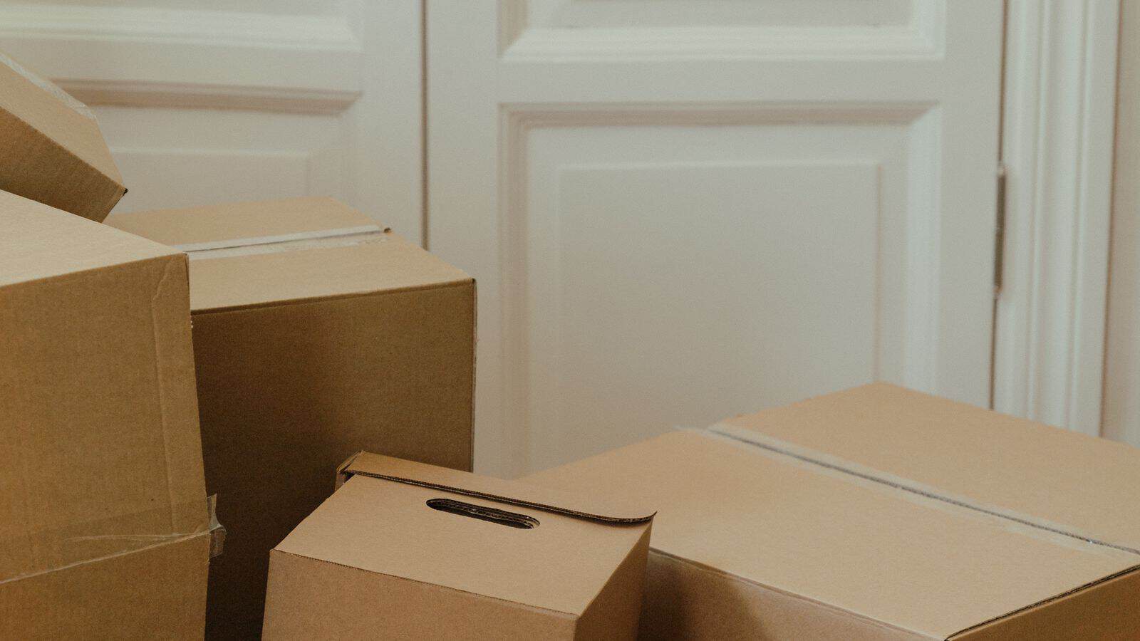 Stacked moving boxes in a Las Vegas apartment representing a renters personal belongings