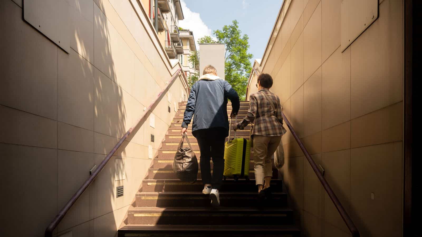Senior couple with luggage leaving a Las Vegas snowbird rental property