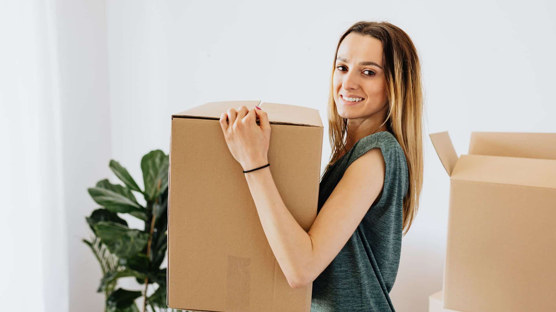 Tenant packing moving boxes before breaking a lease at a Las Vegas rental