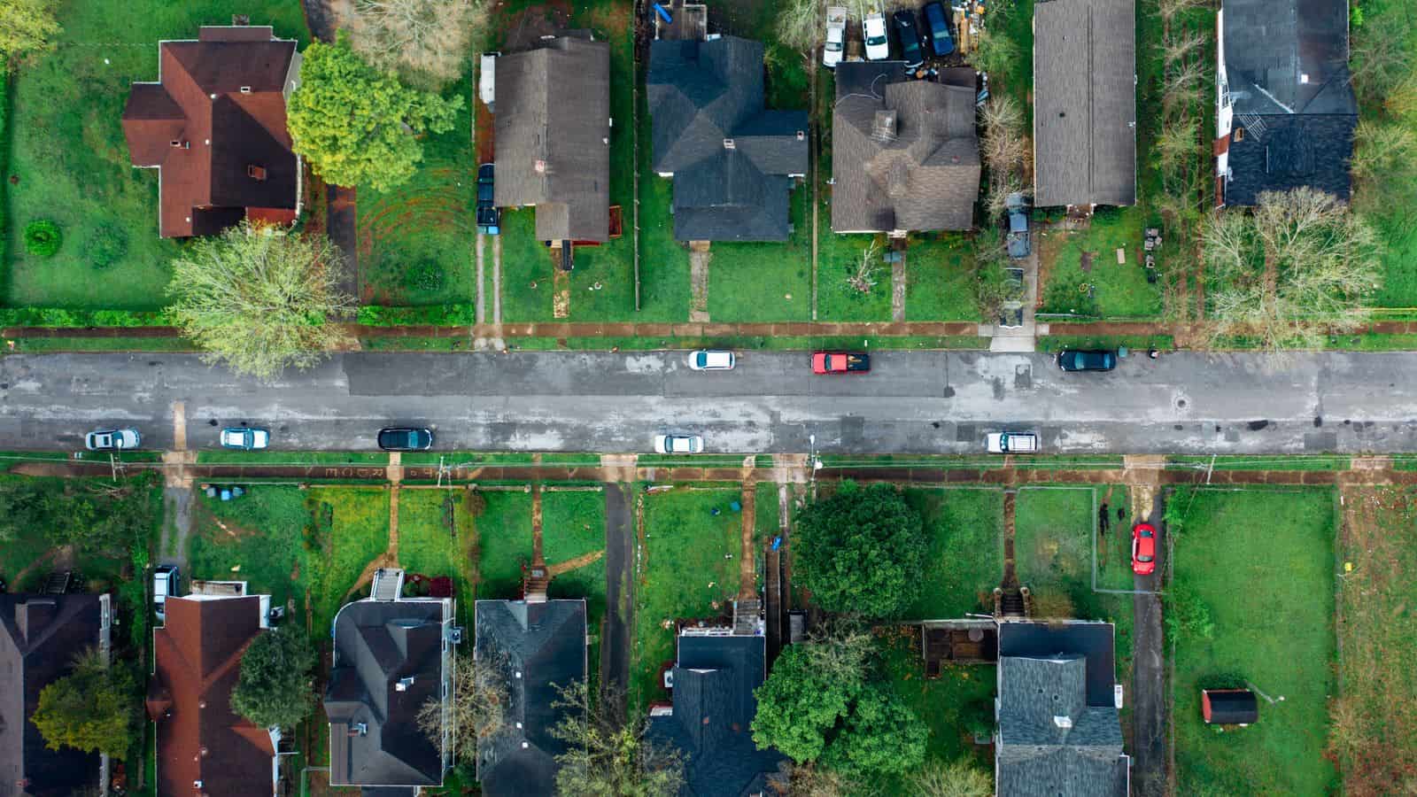 Aerial view of a Las Vegas suburban neighborhood of single family rental homes with rooftops and streets