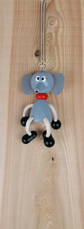 Holzanhänger Hund mit elastischen Gliedern und lustigem Design.