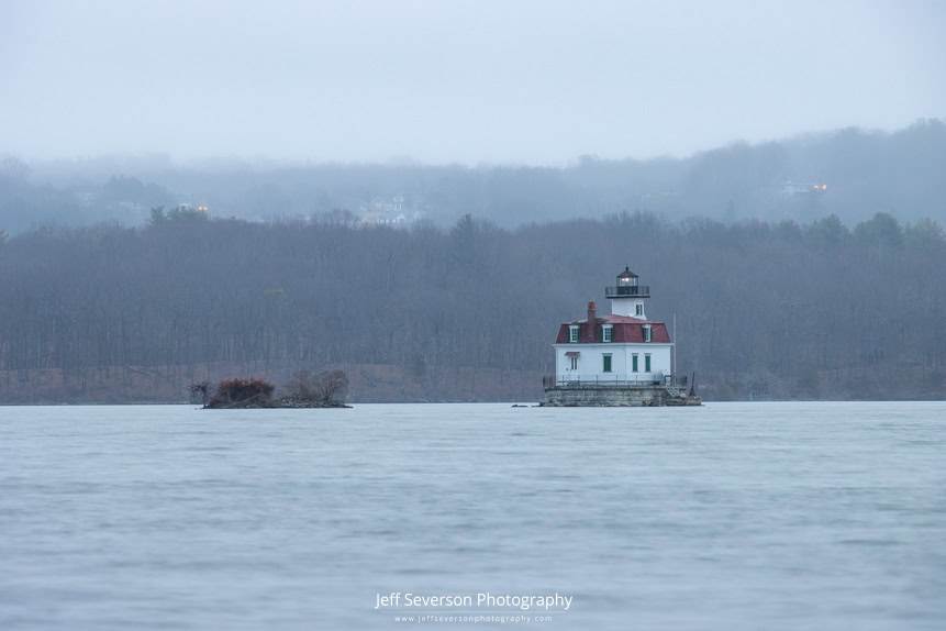 The Esopus Lighthouse at dawn on a foggy first day of Spring shot from the shoreline of Lighthouse Park in Ulster Park, NY.