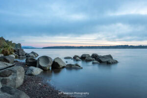 A photo of dawn breaking over the Hudson River from along the shore of Lighthouse Park.