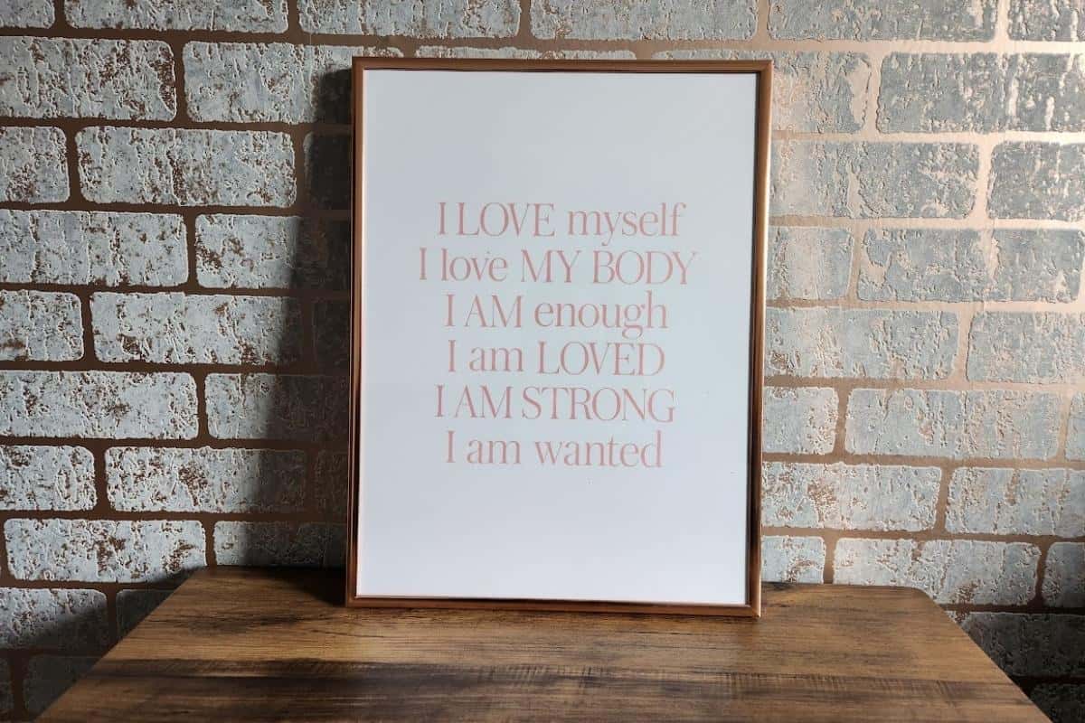 I love myself quote print in a rose gold coloured frame.