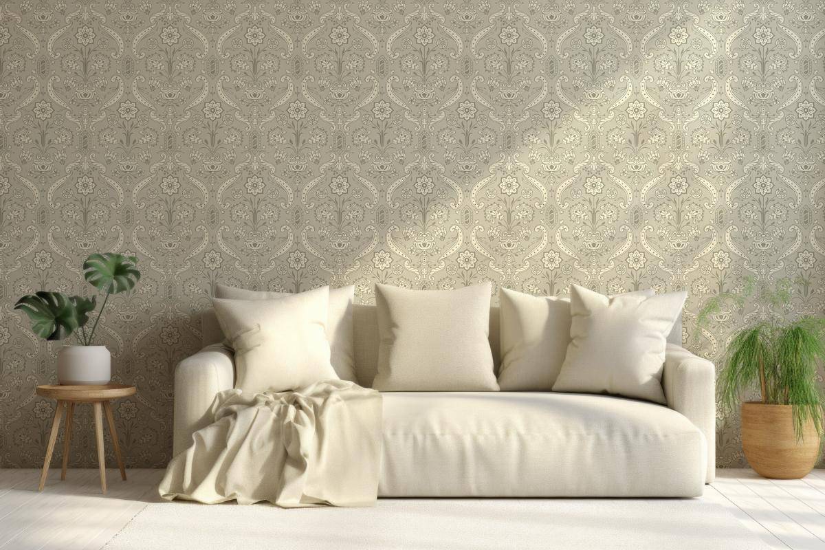 A neutral coloured lounge with a cream sofa and side tables with plants.