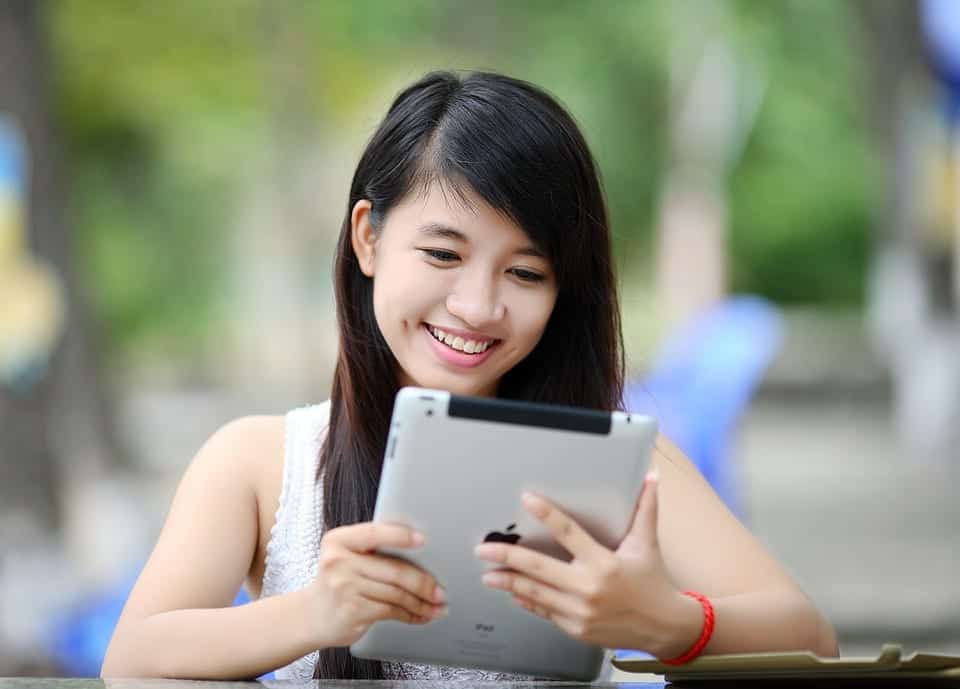 woman happy emotion watching iPad