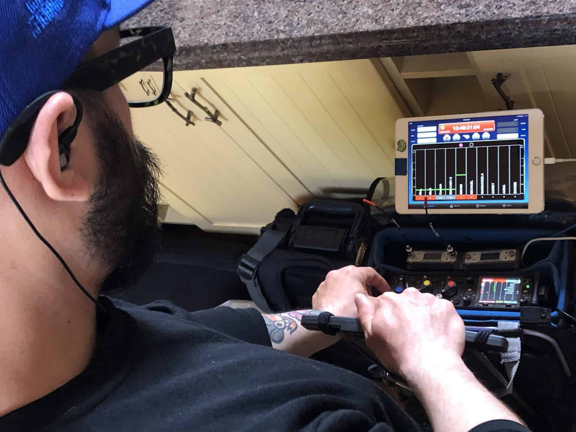 sound tech looks at equipment