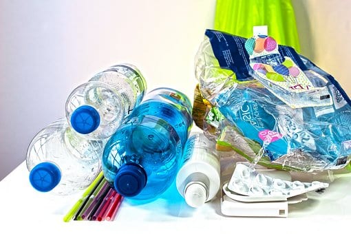 pile of plastic water bottles and other plastic waste