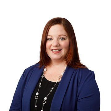 Businesswoman smiling, professional headshot for corporate profile.