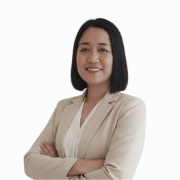 Professional woman in business attire with confident expression.