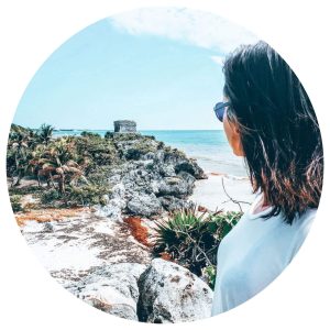 Hannah looking at a Mayan ruin on the coast in Tulum, Mexico
