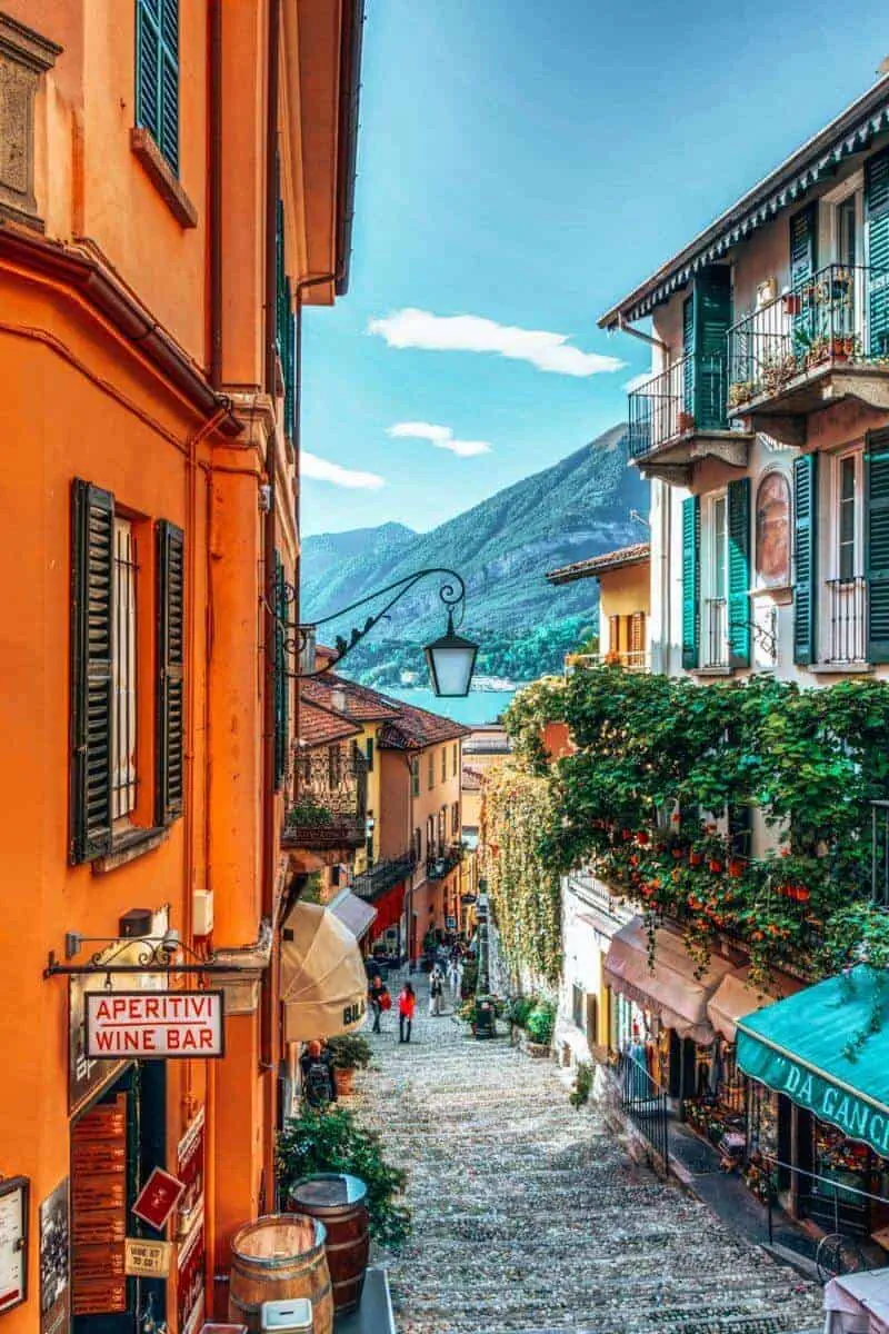 A pedestrianised, steep street with colourful buildings