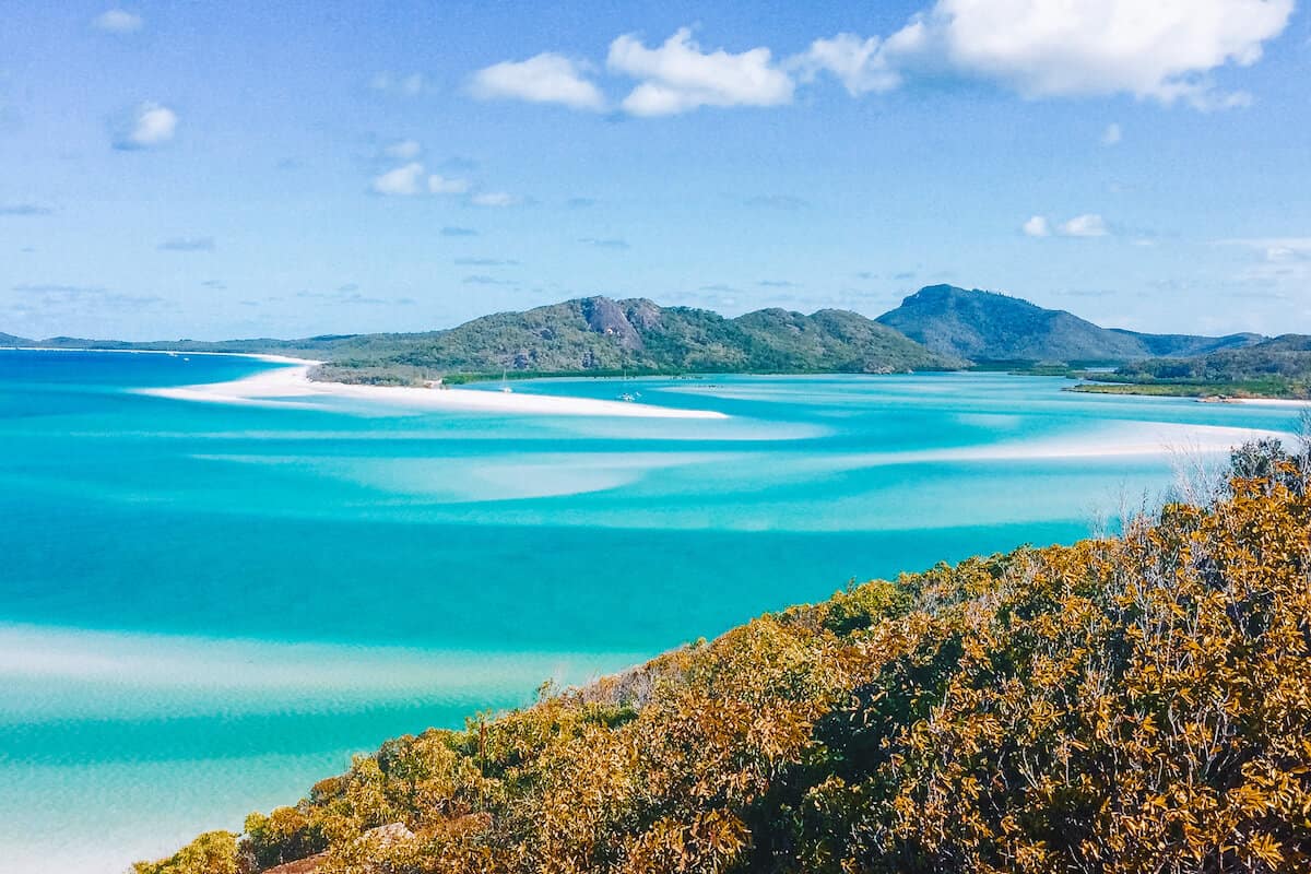View across turquoise sea and Whitehaven Beach in the Whitsundays in Australia
