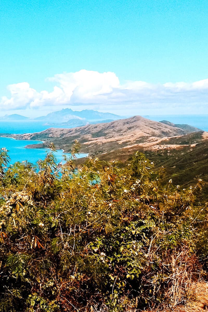 A view across hilly terrain on an island in Fiji