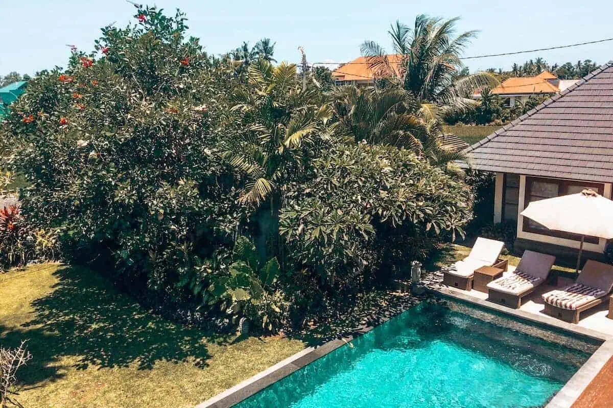 A private pool and sun loungers at a villa in Bali