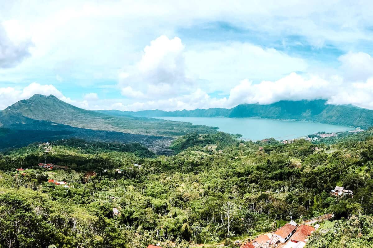 A view across lush rural scenery looking towards a volcano in Bali